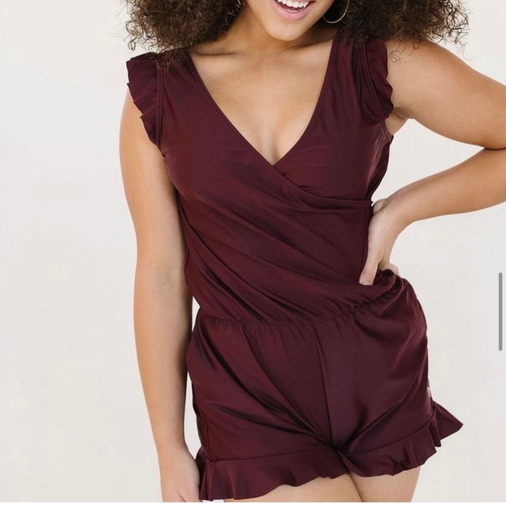 The Ginger Swim Romper from Honeymark. NWT. Deep berry color. Size medium.